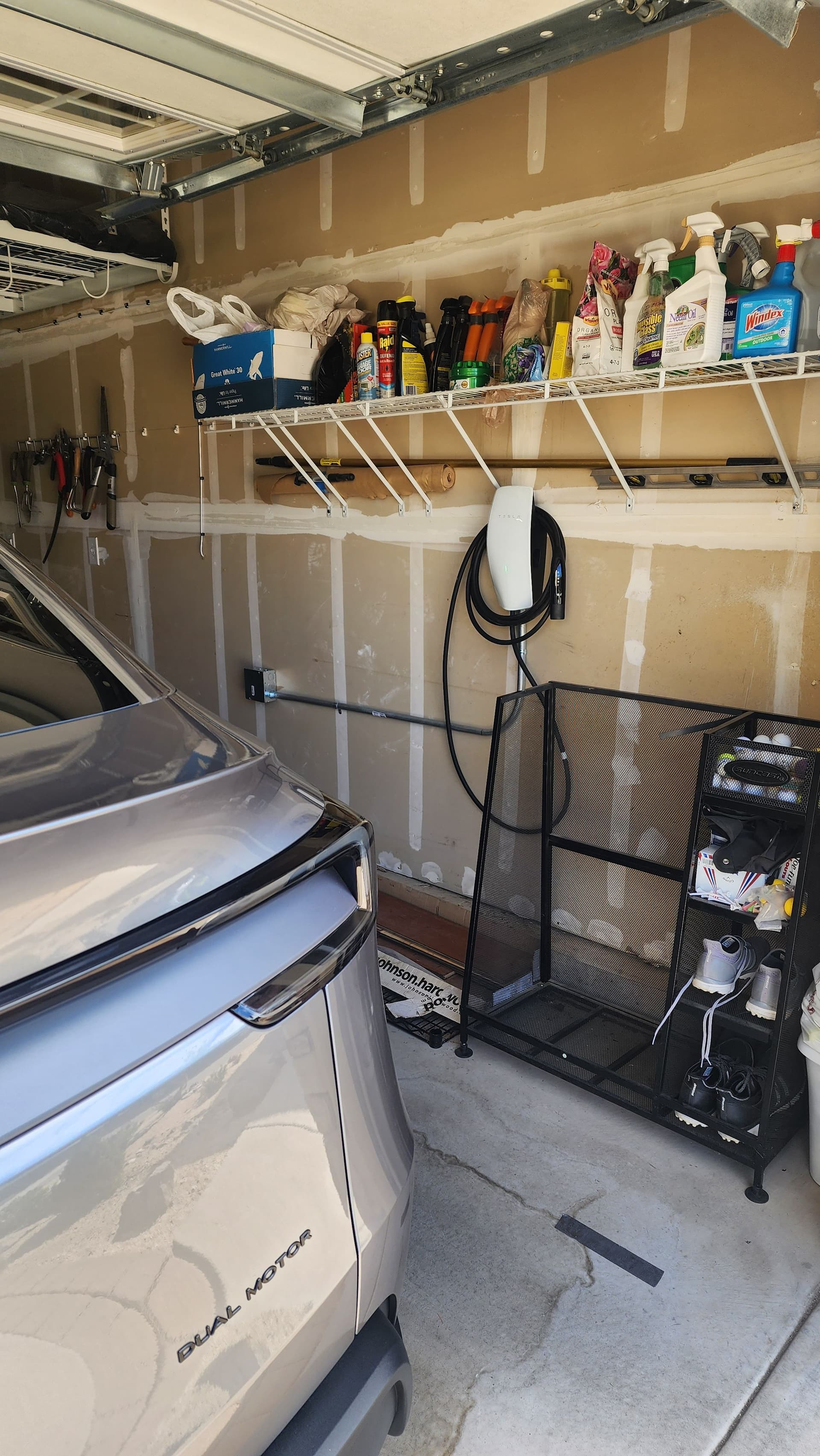 Tesla Wall Connector Installed Clean in a Home Garage image