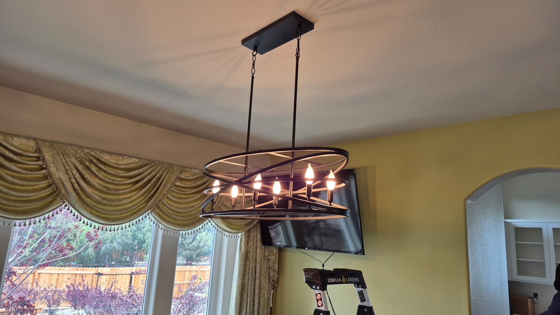 Old Brass Chandelier Swapped for a Sleek Modern Fixture image