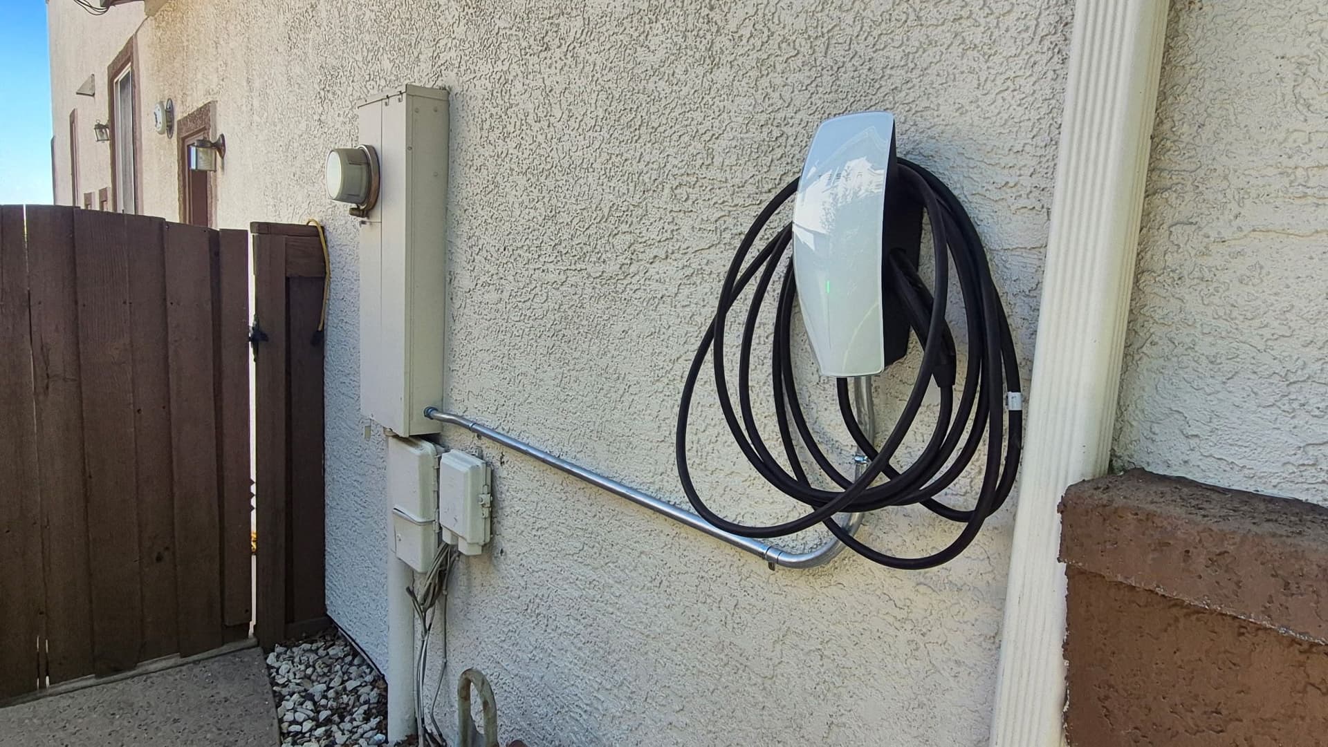 Tesla Wall Connector Installed on Home Exterior image