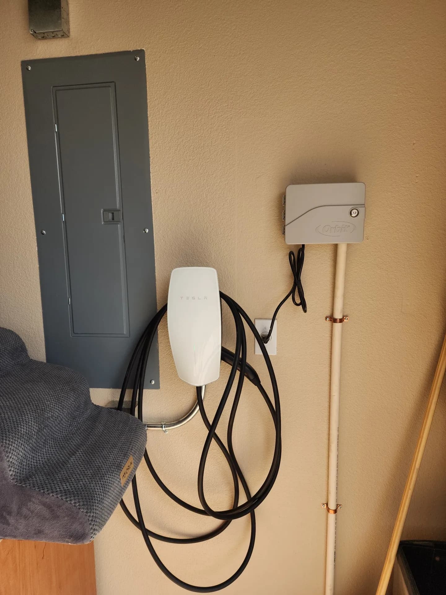 Project Tesla Universal Wall Connector Installed Next to Garage Sub Panel image