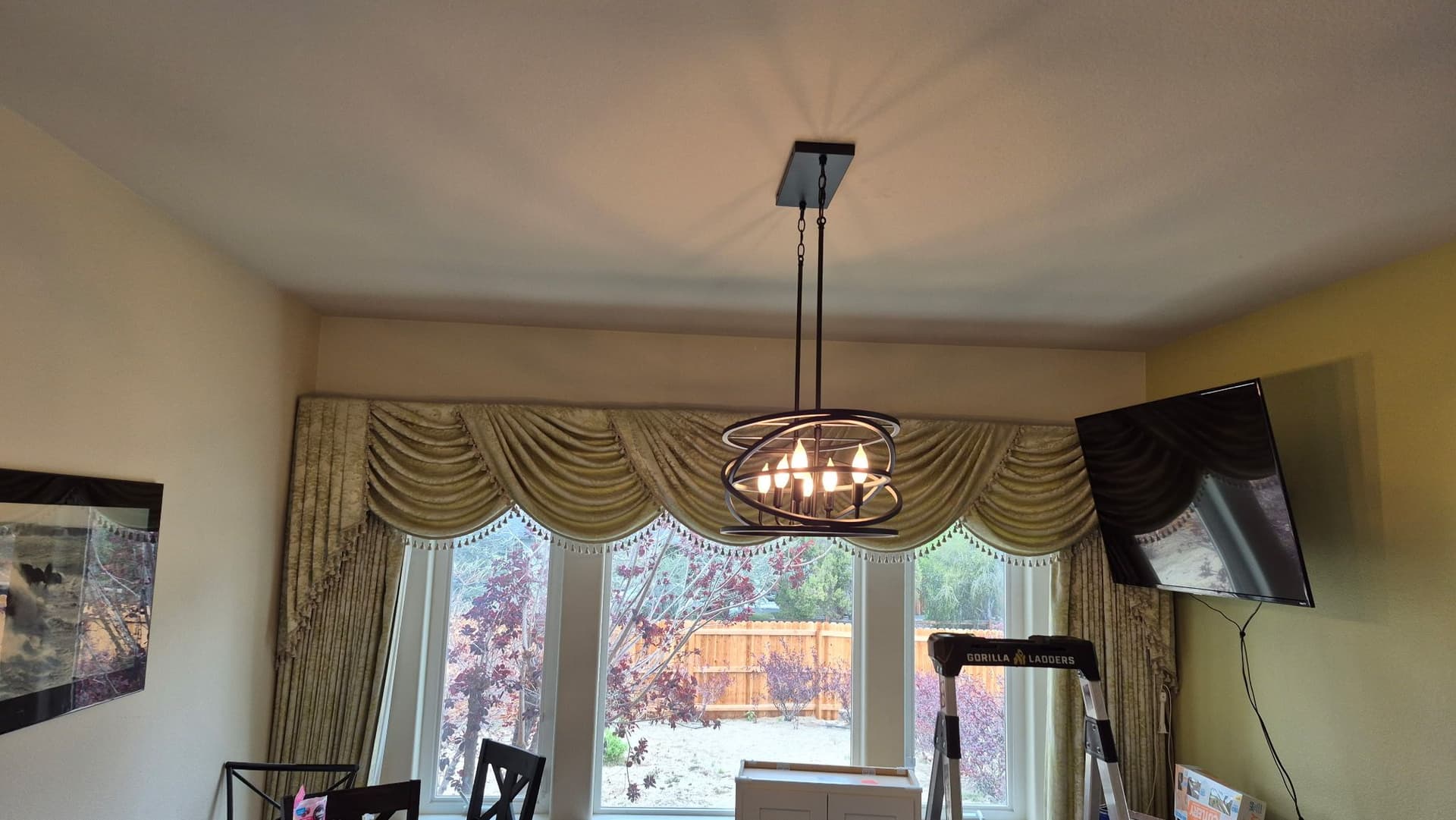 Gallery photos for Old Brass Chandelier Swapped for a Sleek Modern Fixture: Image #1