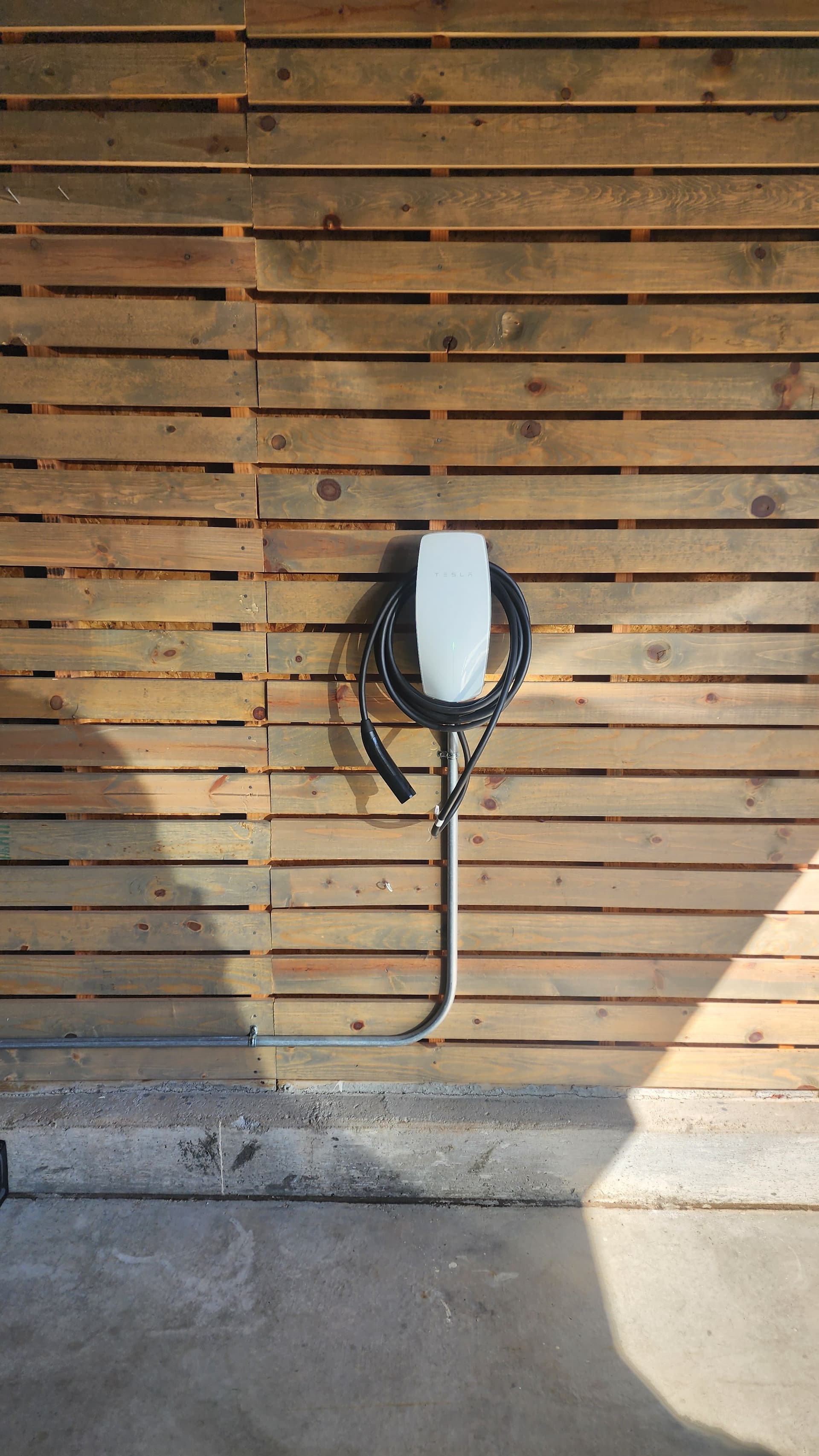 Tesla Wall Connector Installed Clean Through the Crawl Space image