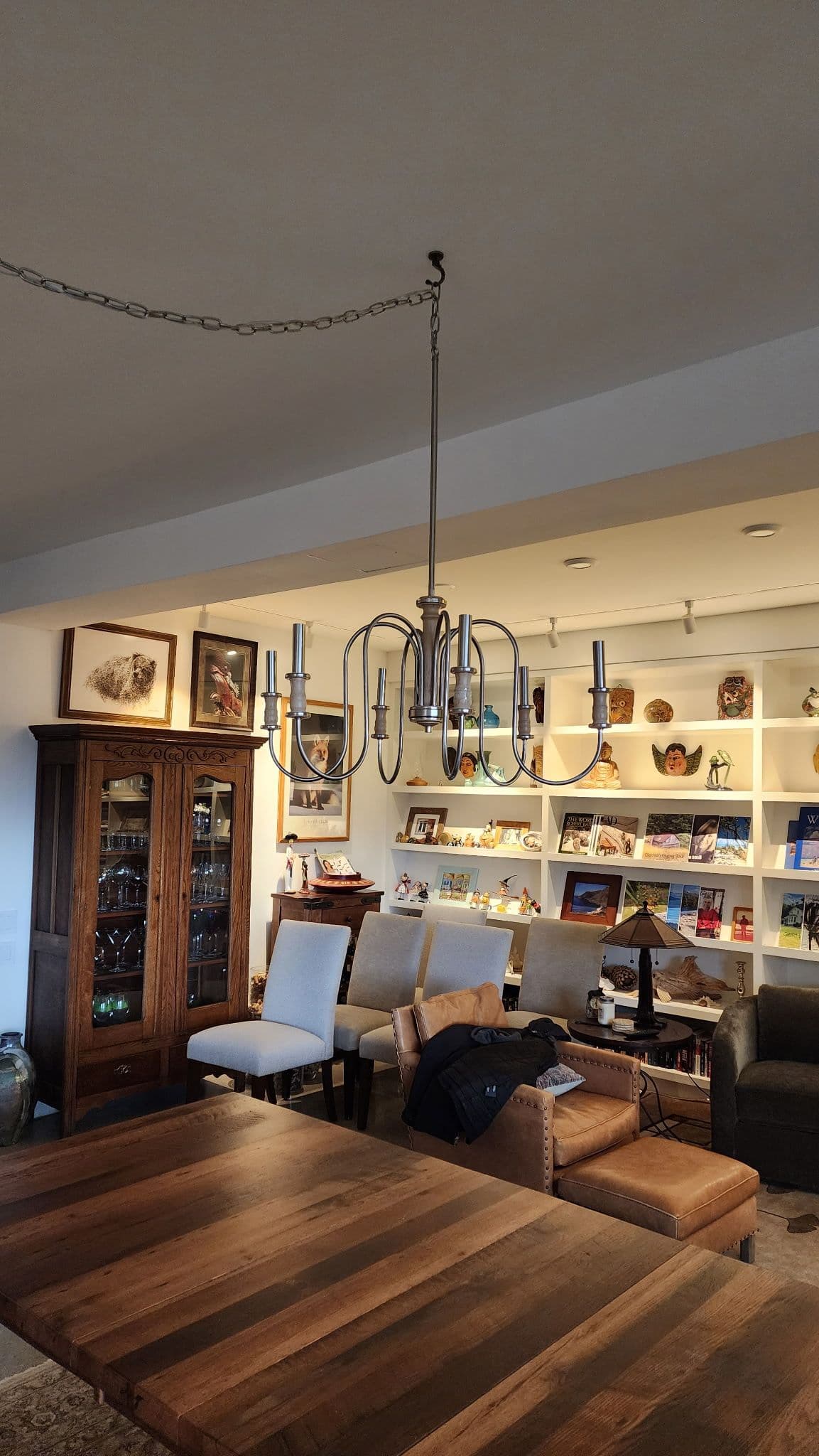 Elegant Chandelier Installation in a Cozy Home image
